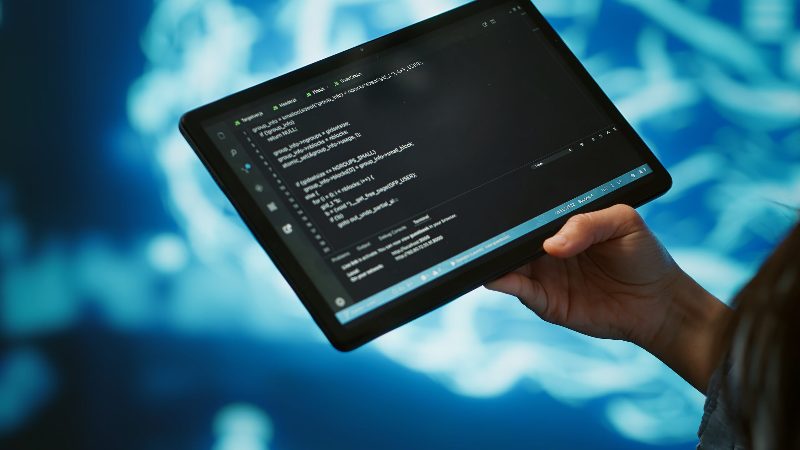 Close up of IT professional using tablet, building AI algorithms